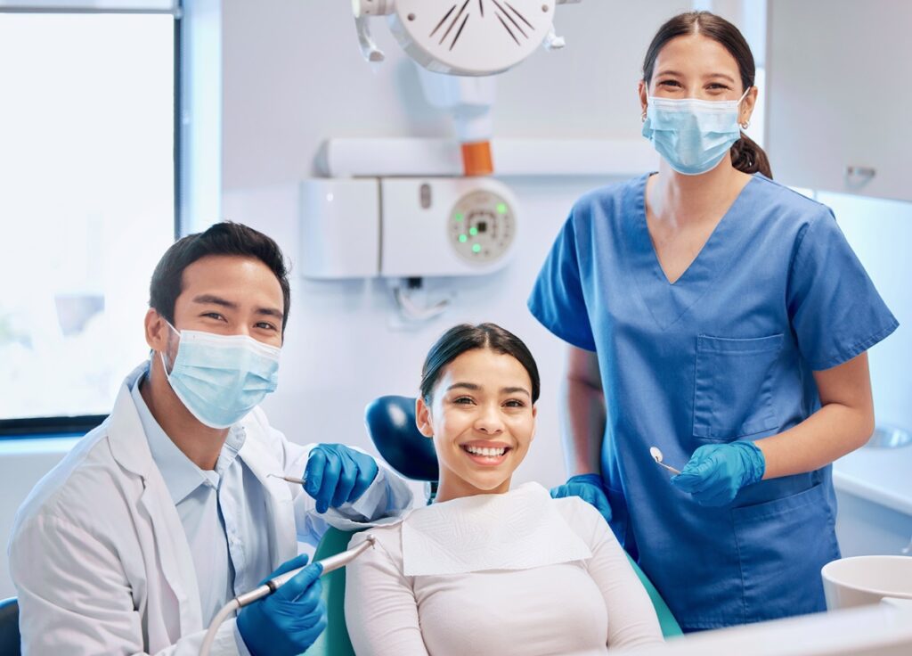 Dental team at Prime Care 360 Multi-Speciality Clinic with a happy patient
